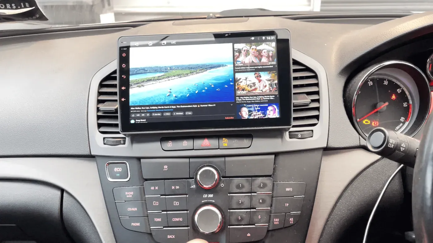 Android car radio display with touchscreen in vehicle interior.