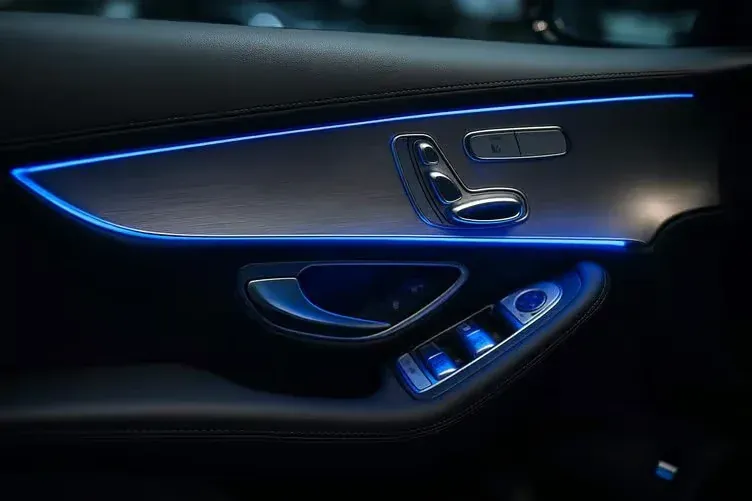 Door card with an ambient light line along the trim and a lit handle recess