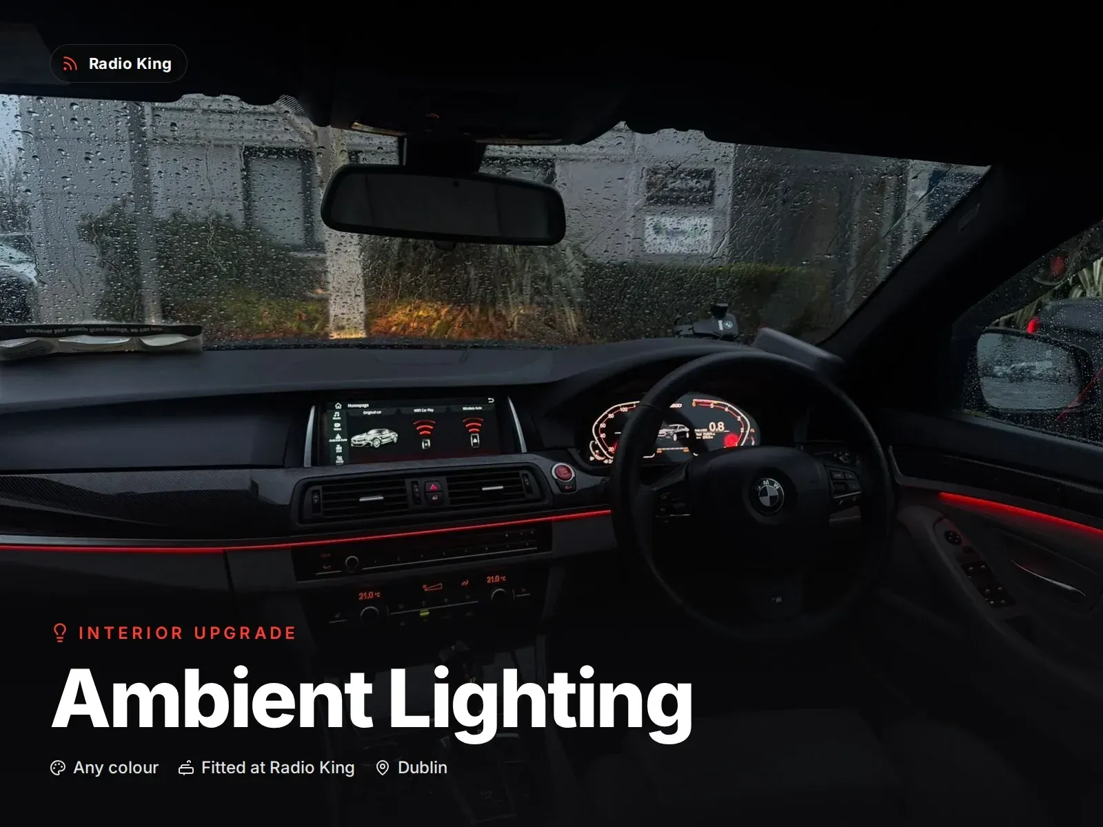 Car interior at night with fibre-optic ambient lighting running along the dashboard and door panels, fitted in Dublin