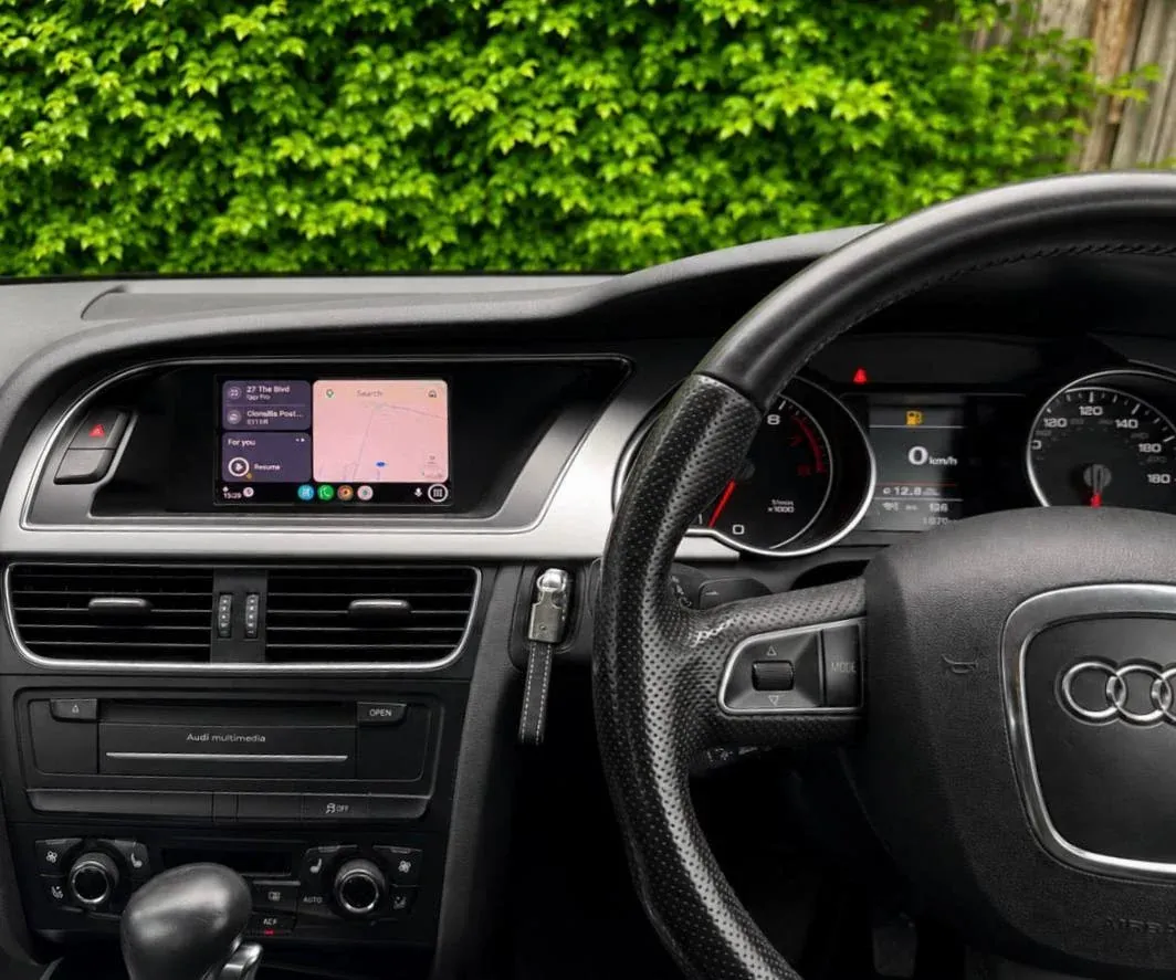 Android Auto running on the original Audi A4 factory screen after activation, dashboard unchanged