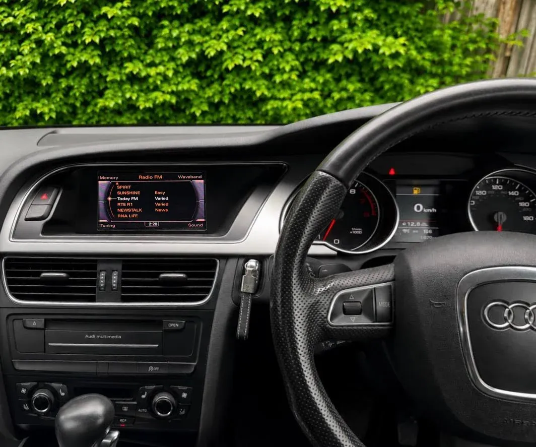 Audi A4 factory radio screen showing FM stations before Android Auto was activated