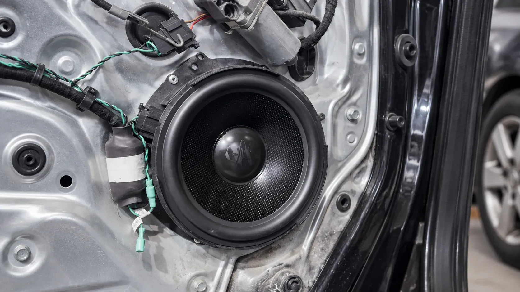 Carbon-cone component speaker fitted into a car door by Radio King Dublin