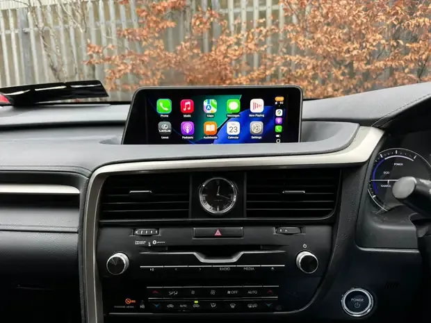 Apple CarPlay home screen with Phone, Music, Maps, Messages and Podcasts icons on a Lexus factory display