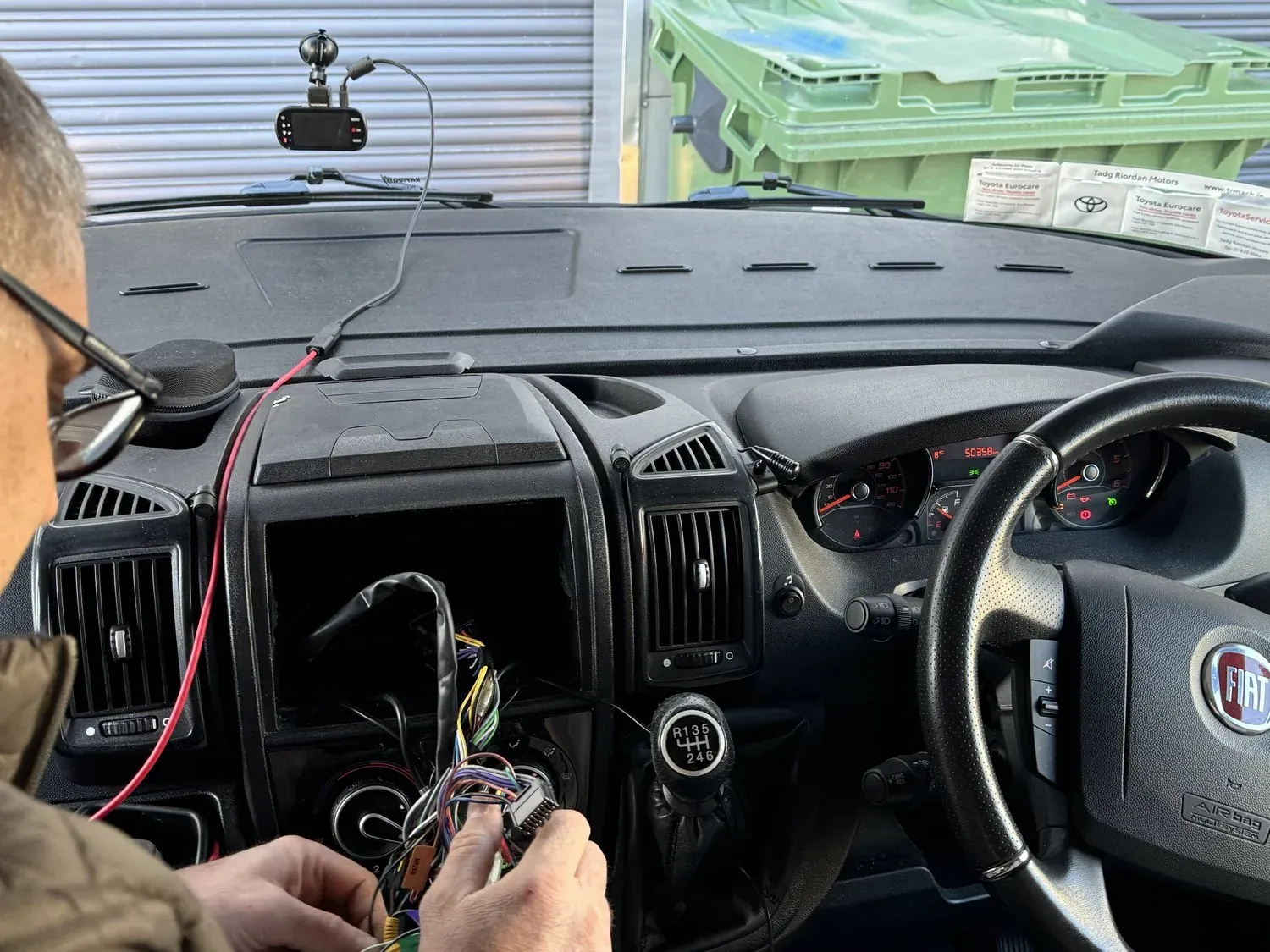 Dash cam fitted to the windscreen of a Fiat Ducato camper van with the cable hidden during a Radio King installation
