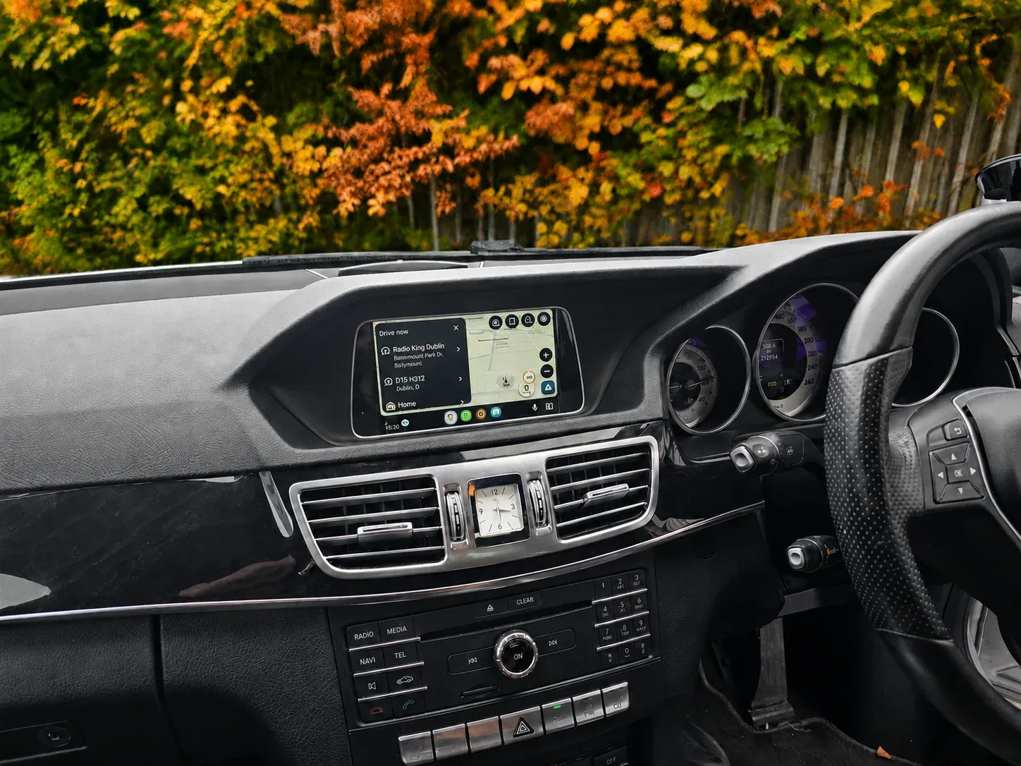 Android Auto with Google Maps navigation on a Mercedes E-Class factory screen in Dublin