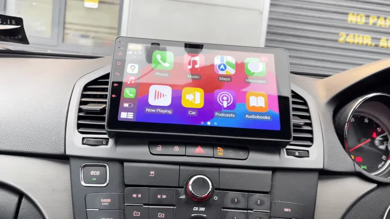Opel Insignia with a 10-inch Android head unit showing the CarPlay home screen