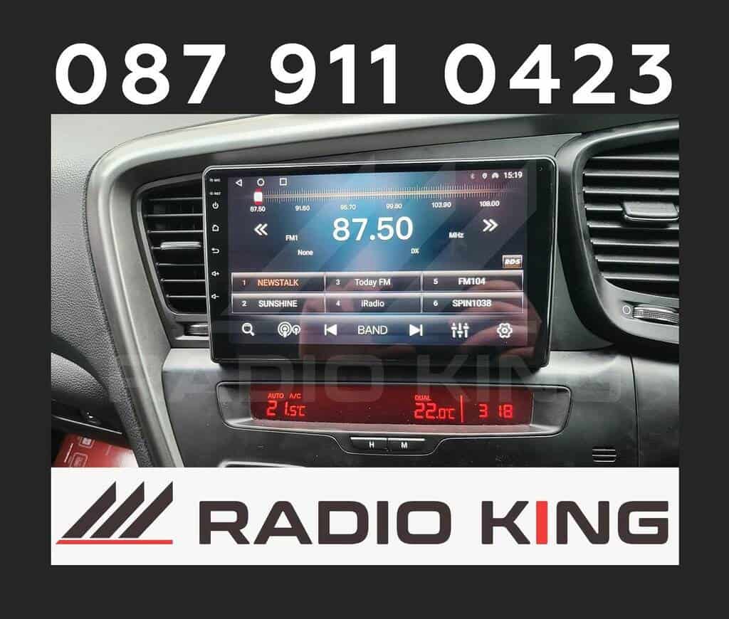87.50 MHz FM radio station display on car stereo with Apple CarPlay system in vehicle dashboard.