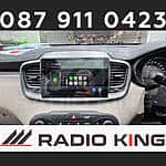 Android car stereo with CarPlay system in a vehicle dashboard, offering multimedia and navigation features.