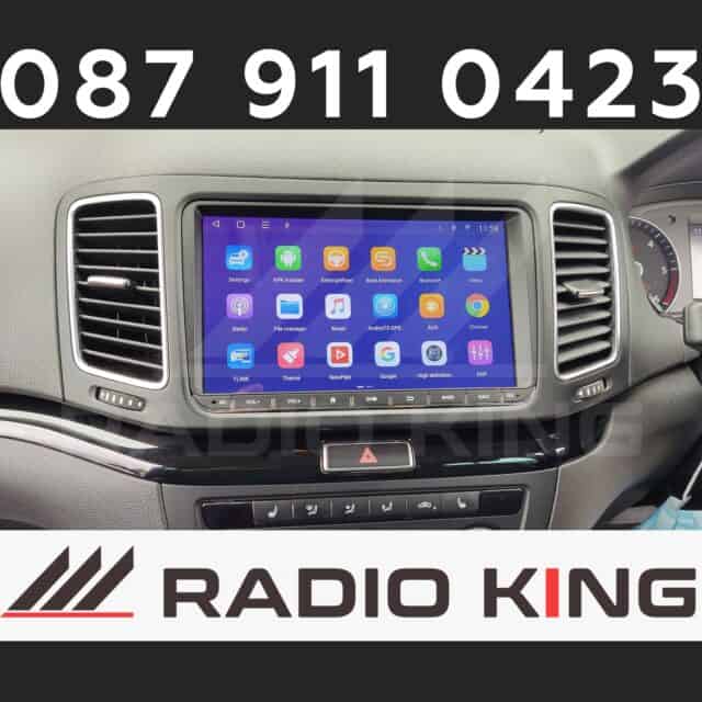 Android car radio system with CarPlay support displayed on a vehicle dashboard.